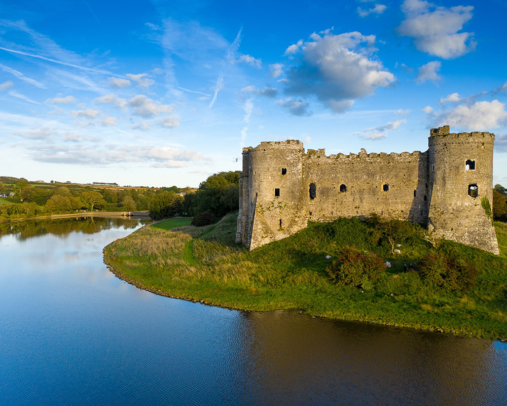 image of a castle surrounded by a lake